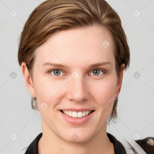 Joyful white young-adult female with medium  brown hair and grey eyes