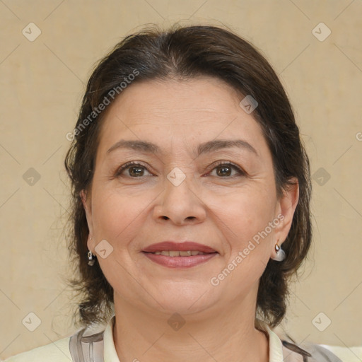 Joyful white adult female with medium  brown hair and brown eyes