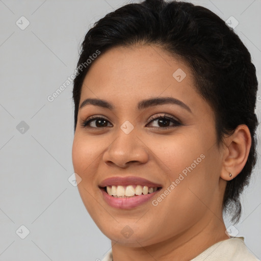 Joyful latino young-adult female with medium  brown hair and brown eyes