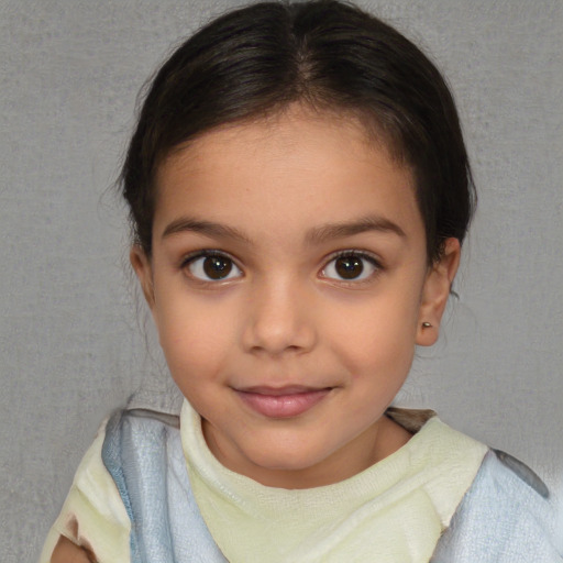 Joyful white child female with short  brown hair and brown eyes