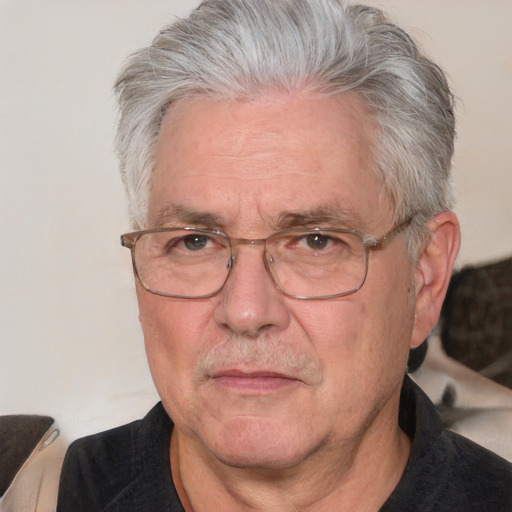 Neutral white middle-aged male with short  gray hair and brown eyes