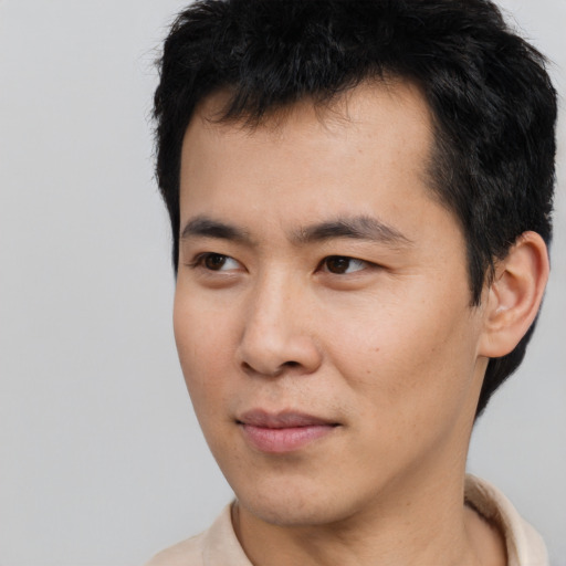 Neutral asian young-adult male with short  black hair and brown eyes