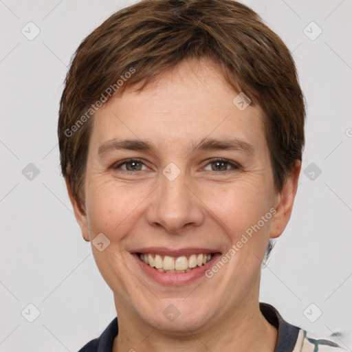 Joyful white adult female with short  brown hair and grey eyes