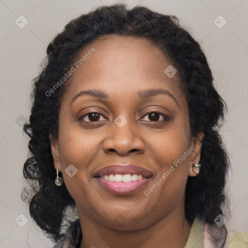 Joyful latino adult female with medium  brown hair and brown eyes