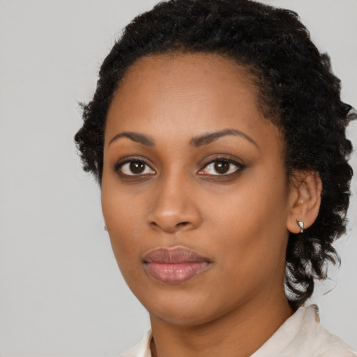 Neutral black young-adult female with long  black hair and brown eyes
