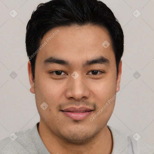 Joyful asian young-adult male with short  black hair and brown eyes