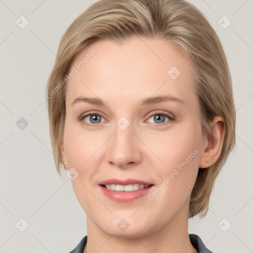 Joyful white young-adult female with medium  brown hair and blue eyes