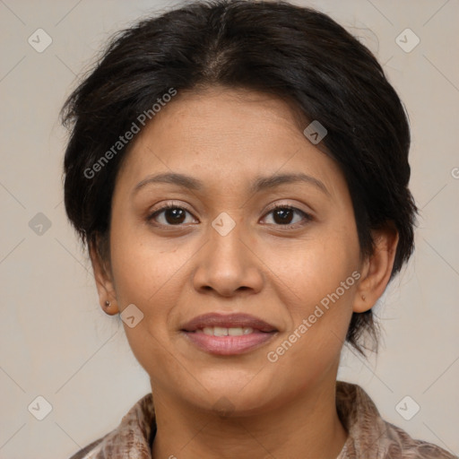 Joyful asian adult female with medium  brown hair and brown eyes