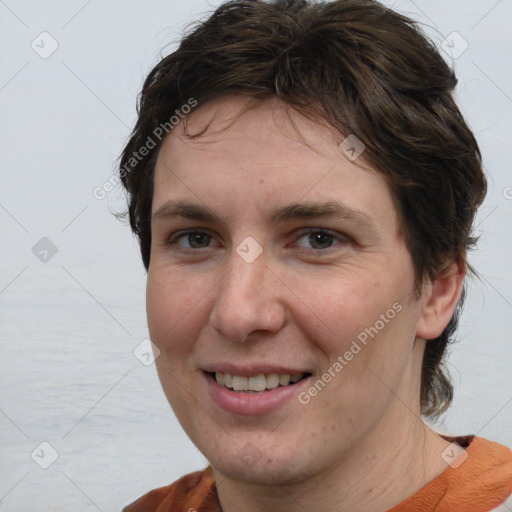 Joyful white adult female with medium  brown hair and brown eyes