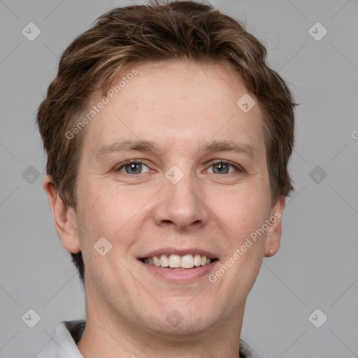 Joyful white adult male with short  brown hair and grey eyes