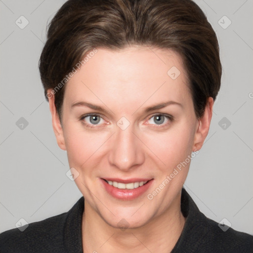 Joyful white young-adult female with short  brown hair and grey eyes