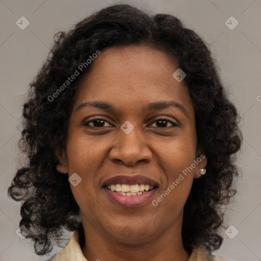 Joyful black young-adult female with medium  brown hair and brown eyes