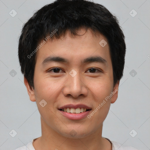 Joyful asian young-adult male with short  brown hair and brown eyes