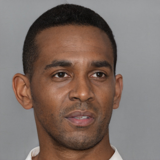 Neutral black young-adult male with short  brown hair and brown eyes
