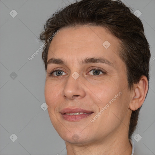 Joyful white adult female with short  brown hair and brown eyes