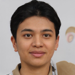 Joyful asian young-adult male with short  brown hair and brown eyes