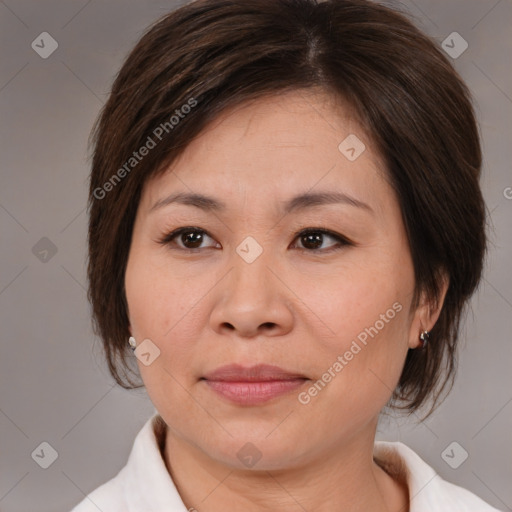 Joyful white adult female with medium  brown hair and brown eyes