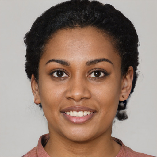 Joyful latino young-adult female with short  brown hair and brown eyes
