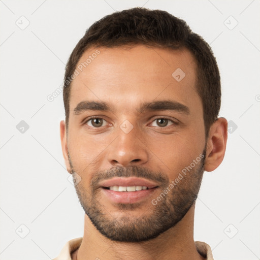 Joyful white young-adult male with short  brown hair and brown eyes