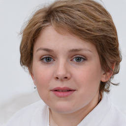 Joyful white young-adult female with medium  brown hair and blue eyes