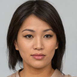 Neutral asian young-adult female with medium  brown hair and brown eyes