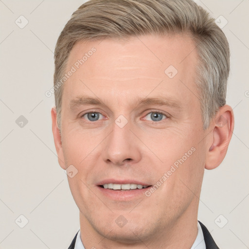 Joyful white adult male with short  brown hair and grey eyes