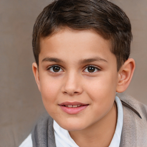 Joyful white child male with short  brown hair and brown eyes