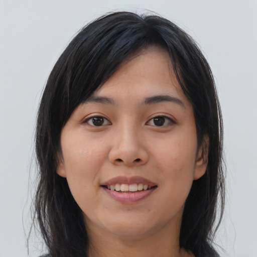 Joyful asian young-adult female with long  brown hair and brown eyes
