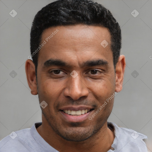 Joyful latino young-adult male with short  black hair and brown eyes