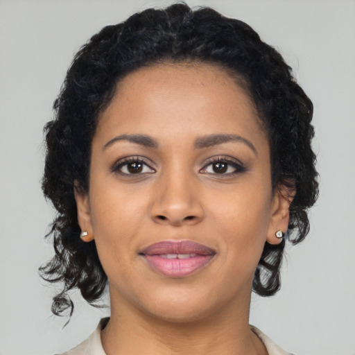 Joyful latino young-adult female with medium  black hair and brown eyes