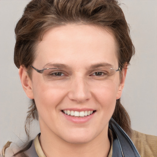 Joyful white young-adult female with short  brown hair and grey eyes