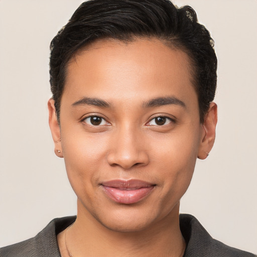 Joyful latino young-adult male with short  brown hair and brown eyes