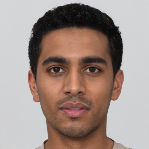 Neutral latino young-adult male with short  black hair and brown eyes