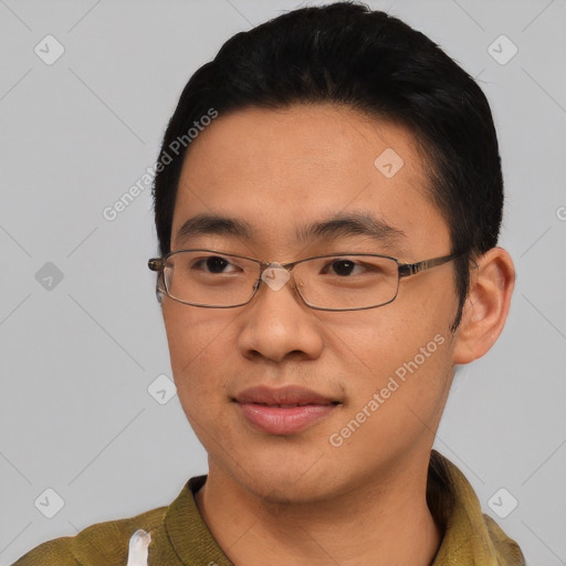 Joyful asian young-adult male with short  black hair and brown eyes