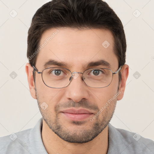 Joyful white young-adult male with short  brown hair and brown eyes