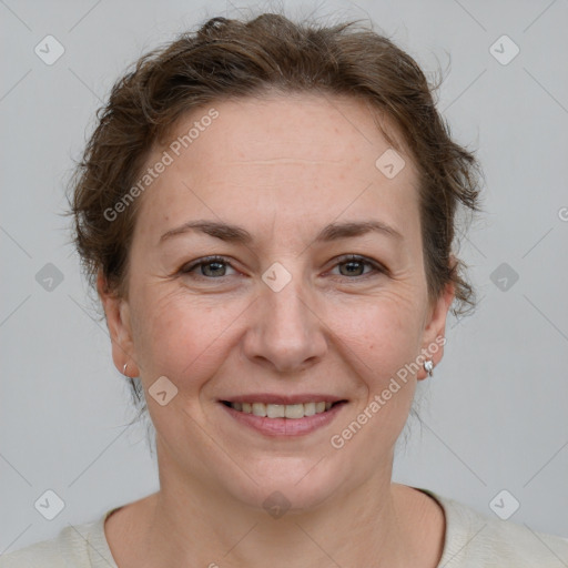 Joyful white adult female with short  brown hair and brown eyes