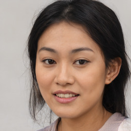 Joyful asian young-adult female with medium  black hair and brown eyes