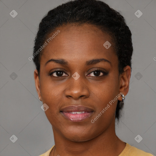 Joyful black young-adult female with short  black hair and brown eyes