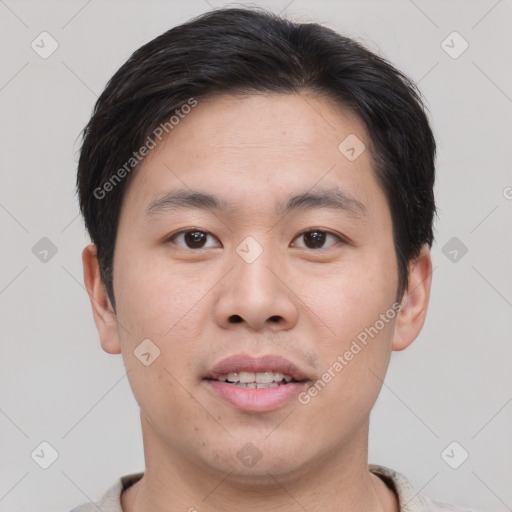 Joyful asian young-adult male with short  brown hair and brown eyes