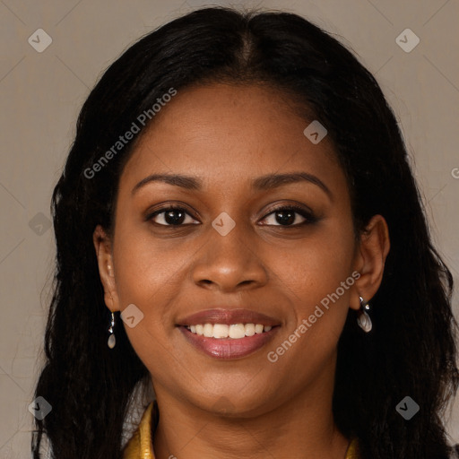 Joyful black young-adult female with long  brown hair and brown eyes