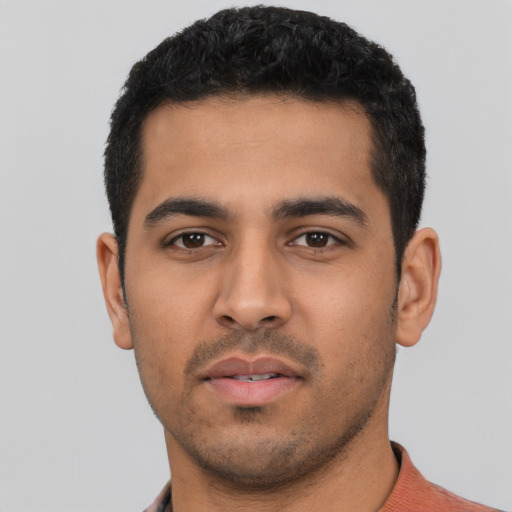 Neutral latino young-adult male with short  black hair and brown eyes
