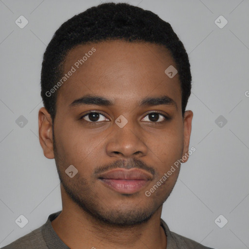 Joyful black young-adult male with short  brown hair and brown eyes