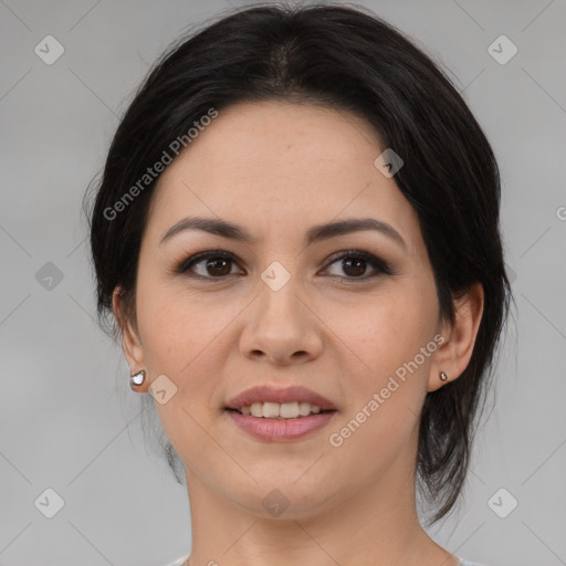 Joyful latino adult female with medium  brown hair and brown eyes