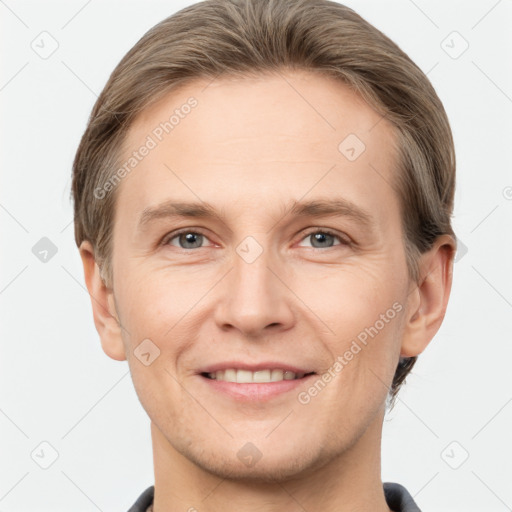 Joyful white adult male with short  brown hair and grey eyes