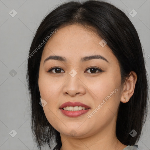 Joyful asian young-adult female with long  brown hair and brown eyes