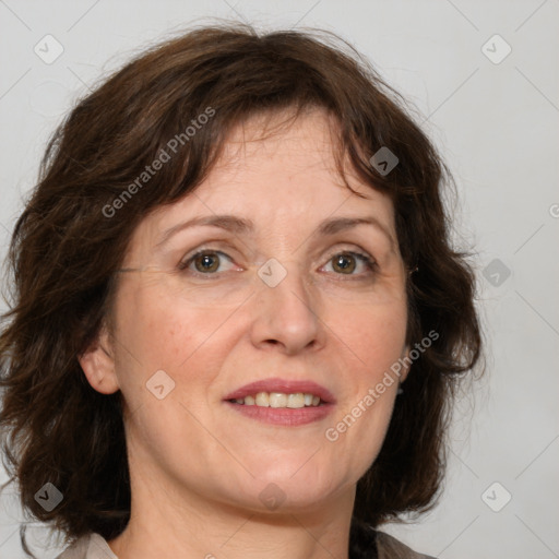 Joyful white adult female with medium  brown hair and grey eyes