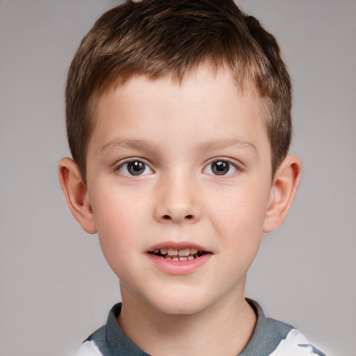 Joyful white child male with short  brown hair and brown eyes