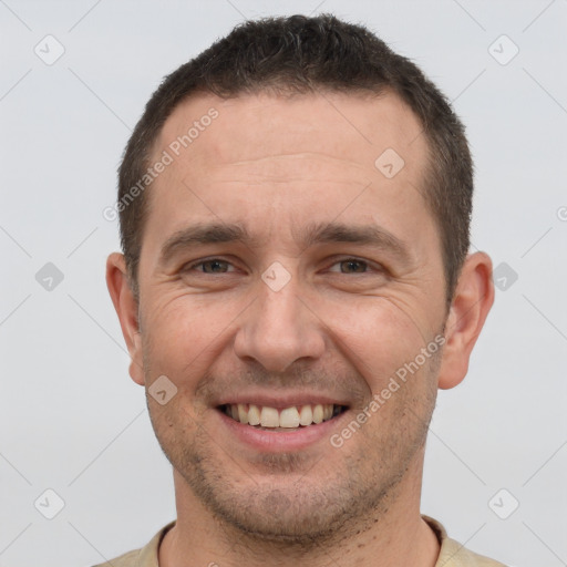 Joyful white young-adult male with short  brown hair and brown eyes