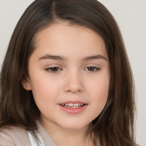 Joyful white child female with long  brown hair and brown eyes