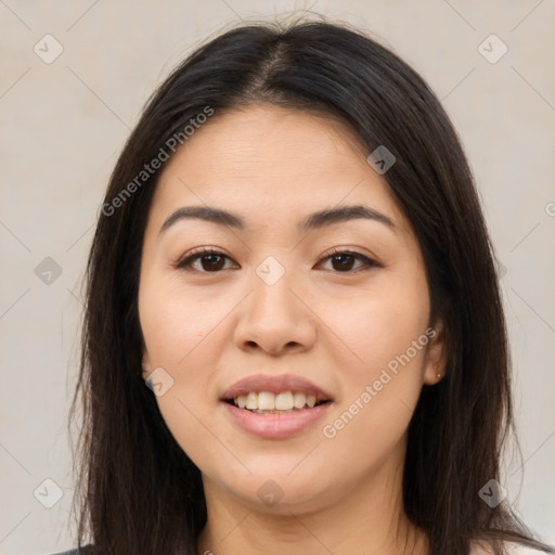 Joyful latino young-adult female with long  brown hair and brown eyes